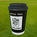 Black Coffee Cup With Coffee Tree Design And Coffee Source Text On Green Grass 3d model
