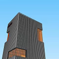 Modern High Rise Office Building With Unique Dark Facade And Colorful Glass Windows