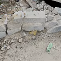 Rubble Pile With Gray Bricks Scattered Small Stones And Blue Green Debris