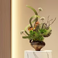 Elegant Vase Floral Arrangement with Green Ribbons White Small Flowers Pine Needles and Brown Vase
