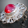 Elegant Silver Ring With Red Gemstone And Intricate Filigree Design