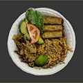 Delicious Asian Food With Stir Fried Noodles Spring Rolls Avocado Tomato Lettuce And Sesame Seeds