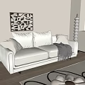Beige Two Seater Sofa With Pillows Gray Blanket Black White Geometric Painting Wooden Floor