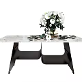 Modern Dining Table With Marble Top Black Metal Legs And White Flower Bouquet
