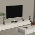 White TV Stand with TV Green Plant Books and Figurines in Modern Living Room View