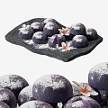 Purple Dessert Balls With Powdered Surface On Black Stone Platter And Flowers