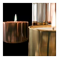 Lit Metallic Colored Candle Lamps In Gold Copper Silver With Multiple Stacked Sizes