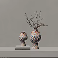 Two Colorful Polka Dot Ceramic Vases With Dried Branches On Books Against Beige Wall