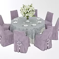Banquet Hall Setup With Round Dining Table White Tablecloth Purple Chairs And Flower Bouquet