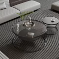 Two Modern Round Coffee Tables With Glass Tops And Metal Frames In Living Room