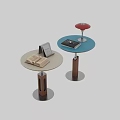 Two Modern Coffee Tables with Round Tops Red Lamp Shade Books and Calendar