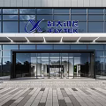 Modern Office Building Exterior With Glass Curtain Walls And Landscaped Entrance Greenery