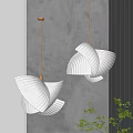 Modern White Pleated Fan Shaped Chandeliers With Gold Accents Against Gray Wall And Green Plants