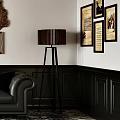 Elegant Living Room Interior With Black Leather Sofa Chandelier Framed Paintings And Patterned Rug