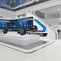 Modern Exhibition Hall With Large Digital Screen Showing City Planning Grid Ceiling And Display Counter