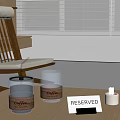 Table With Coffee Cups Reserved Sign Candle And Wooden Chair By Window