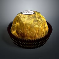 Delicious Round Chocolate With Golden Foil Wrapping And Label On Brown Paper Cup