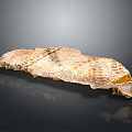 Natural Stone Slab With Textured Surface In Earthy Brown Yellow Tones On Glossy Black Background