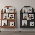 Two Arched Design Bookcases In Brown And Black With Multiple Shelves Holding Magazines