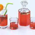 Beverage In Glass With Red Liquid Straw Orange Slice Glass Bottle And Small Glasses