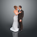 Bride and Groom in Wedding Attire Posing Close Together on Gray Background