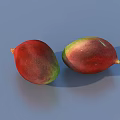 Two Fresh Ripe Mangoes With Red And Green Color On Blue Background