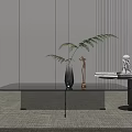 Modern Black Coffee Table with Decorative Items Vase Sculpture and Green Plant on Minimalist Rug