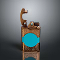 Vintage Bronze Lighter With Decorative Engraved Pattern And Blue Circular Accent