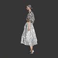 Stylish Woman In Striped Top And Patterned Skirt With Belt Standing Against Grey Background