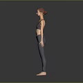 A Woman Wearing Grey Sports Bra And Leggings Standing With Arms Outstretched Against Grey Background