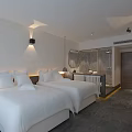Modern Hotel Guest Room With Twin Beds Mountain View Large Windows And Vanity