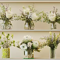 Different Style Vases With White Flowers And Green Foliage On Shelves Decor