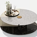Modern Coffee Table with Textured Silver Top and Decorative Tray Holding Green Plant Books
