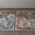 Two Square Rugs With Brown Gray Texture And Fringes On Wooden Floor