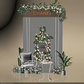 Chanel Themed Floral Display With Flower Wall Green Plants And Decorative Chair