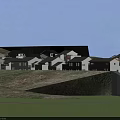 Traditional Style Buildings With White Walls Black Tiles On Hillside And Green Vegetation