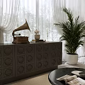 Vintage Gramophone On Dark Cabinet With Circular Motifs Sheer Curtains And Large Potted Plant