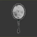 Elegant Handheld Mirror With Ornate Handle And Carved Edge Design