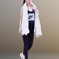 Woman Wearing Black Nike Vest And Leggings With White Towel Over Shoulder
