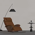Modern Interior With Brown Leather Recliner Black Floor Lamp Side Table Books And Round Rug
