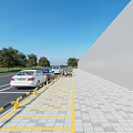 Modern Road Facilities With Parking Spaces Yellow Lines Guardrails Parked Cars And Paved Sidewalk
