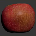 Fresh Red Apple With Yellow Spots On Dark Reflective Surface