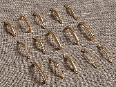 Decorative Vintage Brass Cabinet Handles Various Styles Arranged on Textured Fabric 3d model