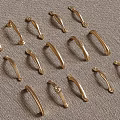 Decorative Vintage Brass Cabinet Handles Various Styles Arranged on Textured Fabric
