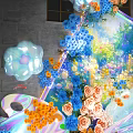 Colorful Floral Art Installation With Pink Roses Yellow Blue Flowers And Cloud Shaped Decor