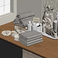 Soft Gray Towels on Modern Bathroom Countertop with Folded and Rolled Stacks and Bath Accessories