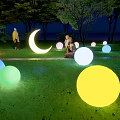 Illuminated Garden Ornaments Featuring Colorful Spheres And Moon Shape On Night Lawn With Trees