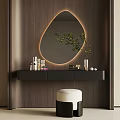 Modern Black Dressing Table with Illuminated Oval Mirror Skincare Products and Green Plant