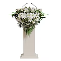 Elegant White Podiums With Various Floral Decorations And Greenery Accents