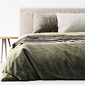 Cozy Double Bed With Green Velvet Bedding Pillows And Wooden Side Table
